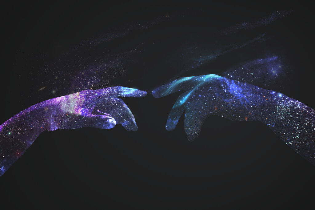 Hands in a digital universe background